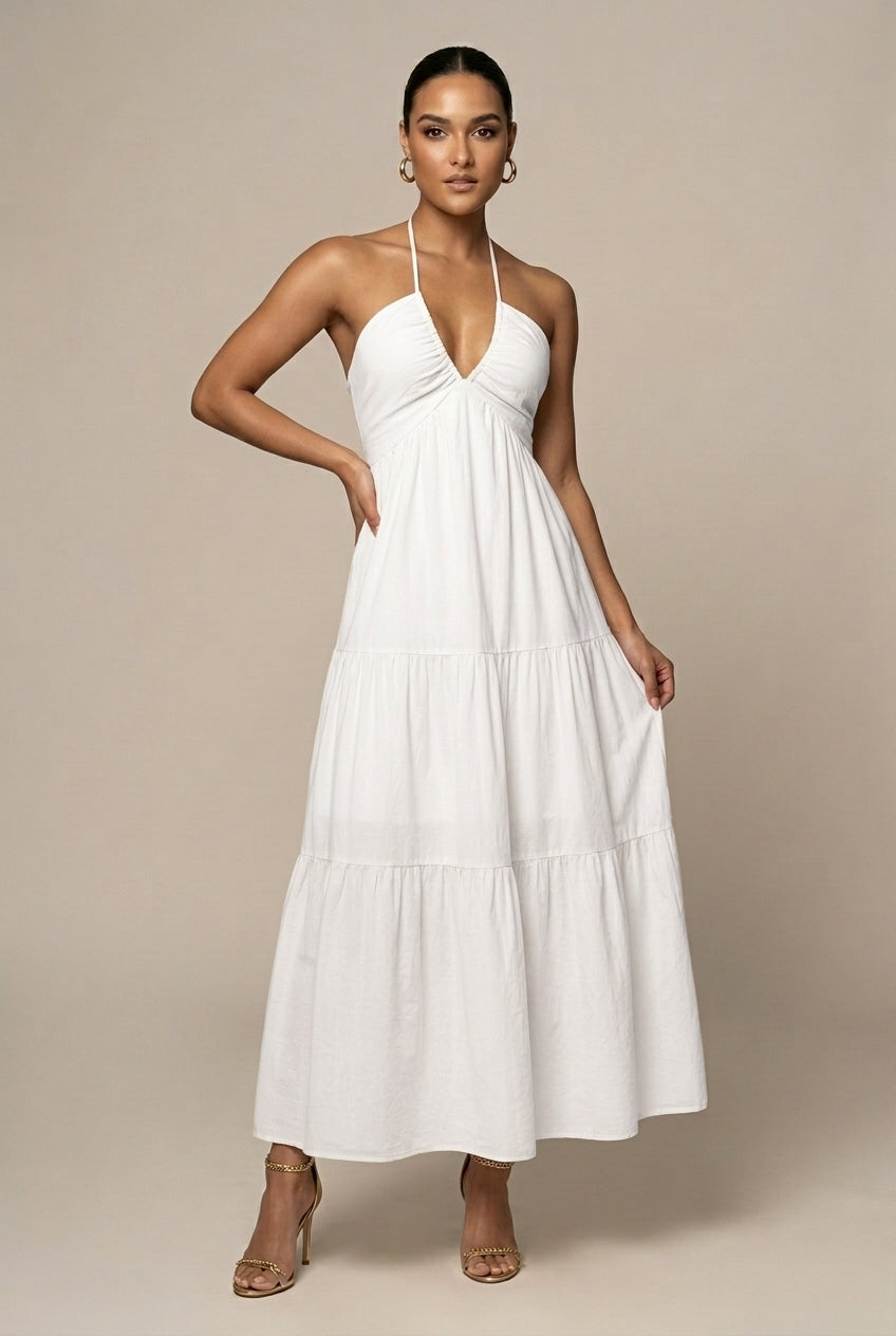 Chic women's tiered ruffle maxi dress with an elegant halter neck, open back, and tie waist for a graceful look.