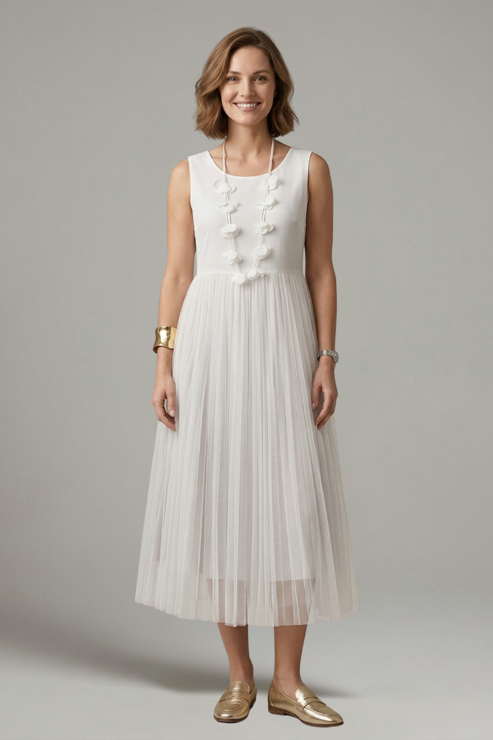 Comfortably elegant women's layered dress, with a stylish pleated midi skirt and long sleeves for versatile wear.