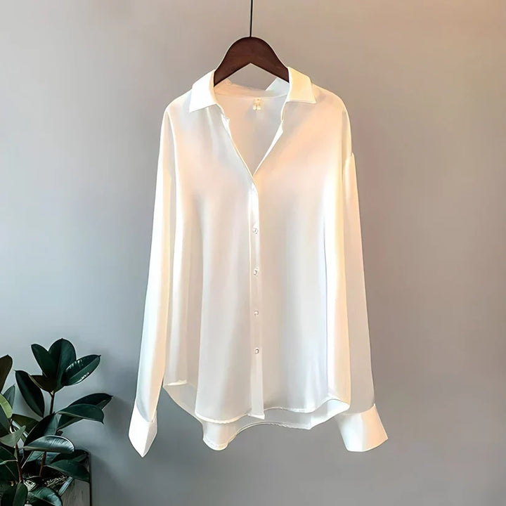 Refined women's long sleeve blouse, ideal for elegant office attire or versatile everyday fashion.