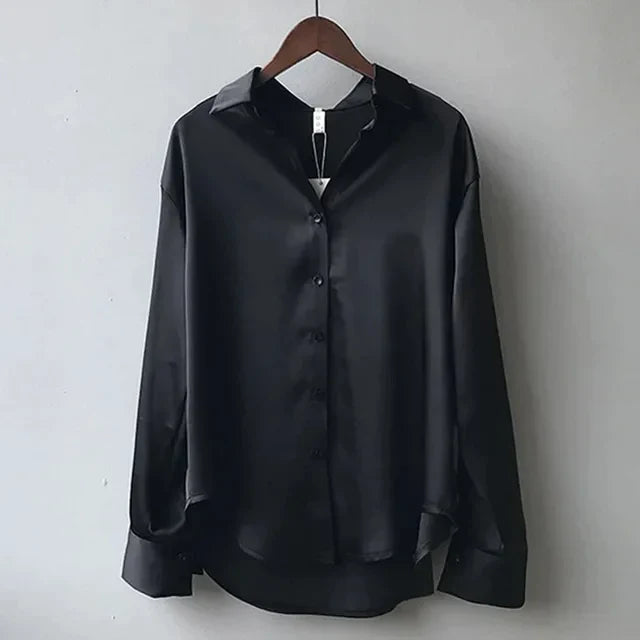 Stylish women's satin long sleeve blouse featuring a classic button-down design, suitable for formal and casual occasions.