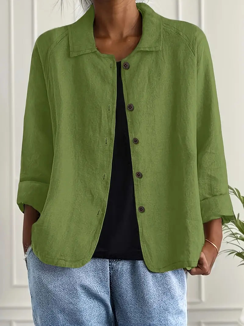 Soft, flowing fabric of women's elegant long sleeve button-up blouse. Sophisticated and comfortable workwear top.