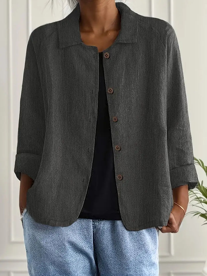 Women's elegant button-up blouse; a versatile long sleeve top for the office or a chic weekend look. Relaxed fit.