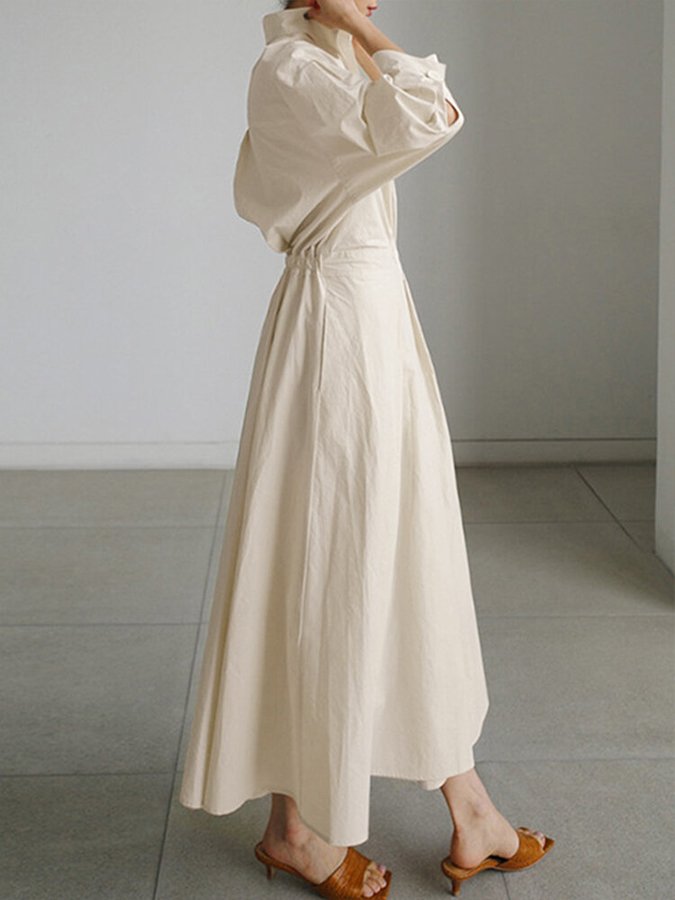 Sophisticated women's elegant maxi dress. Puff sleeves, twist waist, V-neck, A-line, long style.