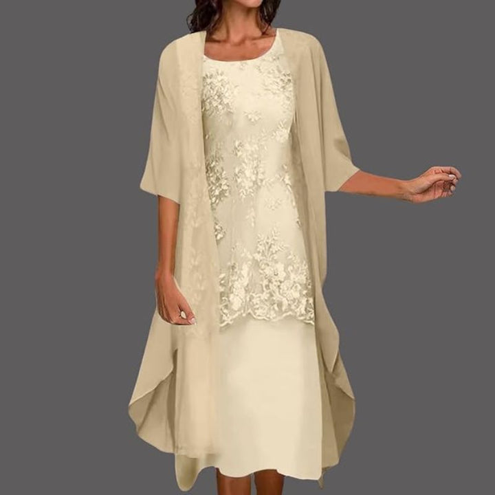 Sleeveless summer midi dress for women paired with a chic cardigan. Ideal elegant two-piece set for parties.