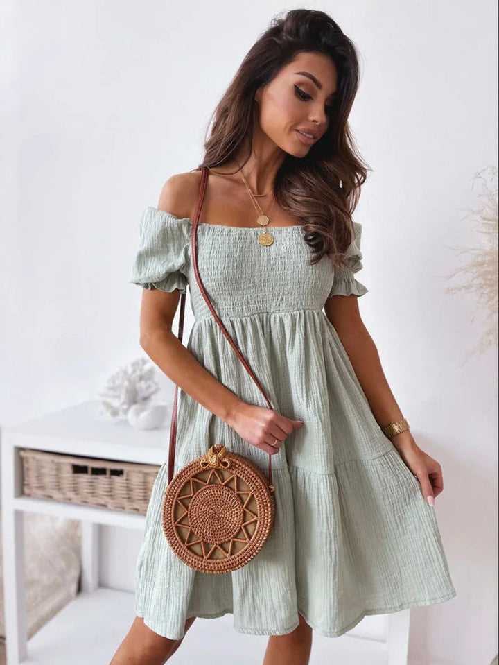 New arrival: Women's elegant one-shoulder mini dress. A stylish choice for summer parties & fashion events.