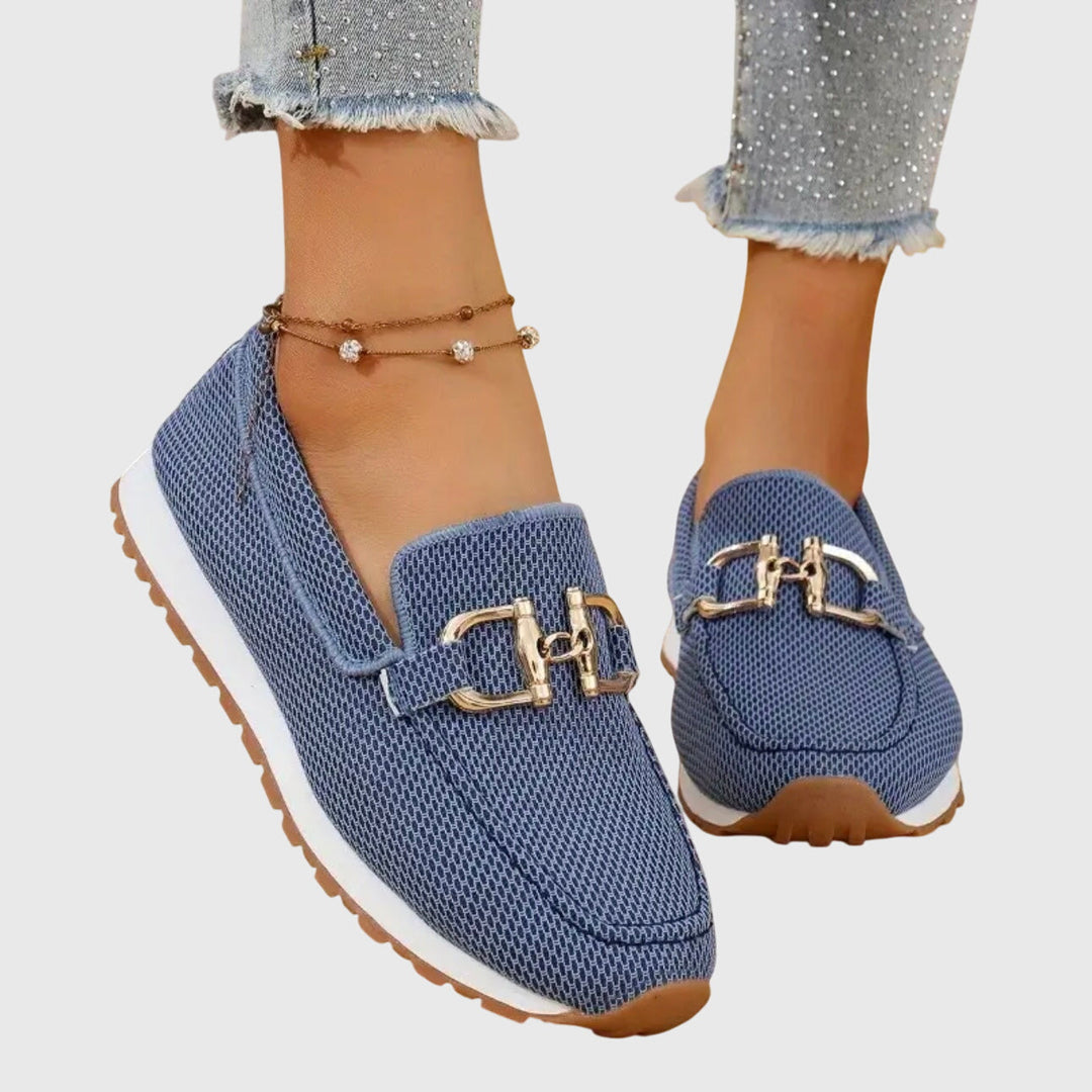 Elegant women's orthopedic loafers with gold-tone horsebit, offering comfort, foot support, and slip-on style.