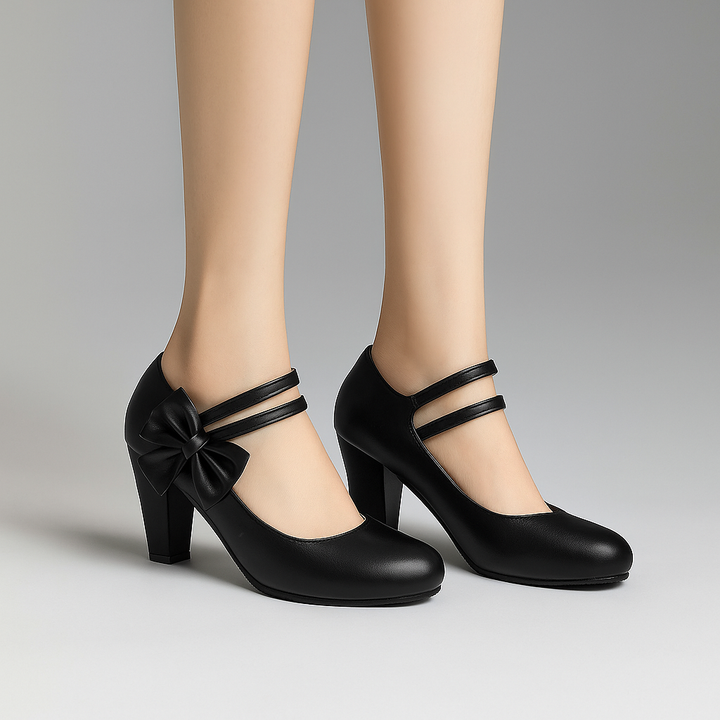Purple block heel pumps adorned with a delicate bow, designed for women seeking comfort and style.
