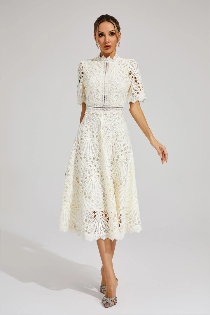 Back view of an elegant white lace midi dress, highlighting its sophisticated design for women.