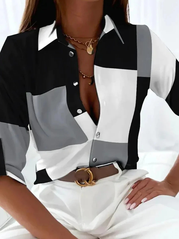 Stylish gold printed button-down blouse for women, three-quarter sleeve, versatile for office or casual wear.