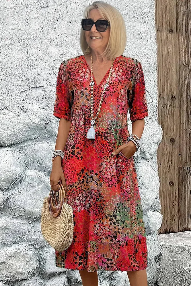 Close-up of vibrant floral print on elegant women's midi dress, showcasing comfortable spring fashion.