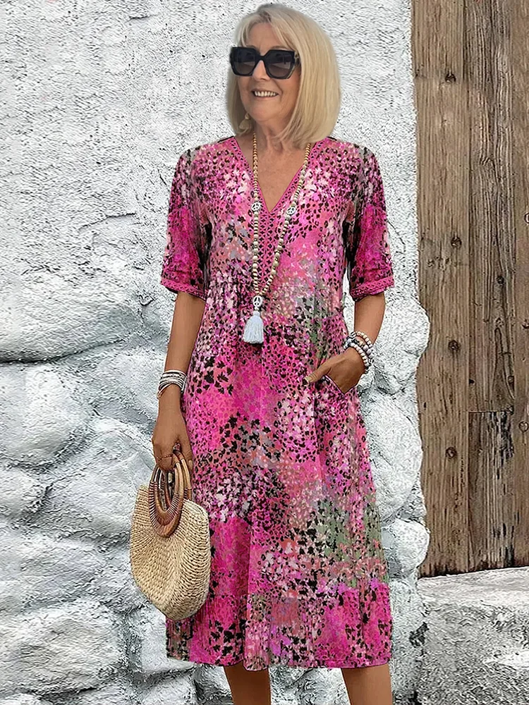 Beautiful women's A-line printed midi dress featuring a flattering V-neck, ideal for elegant summer style.