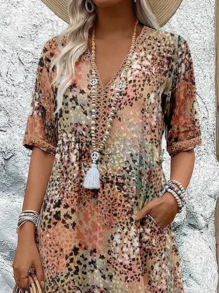 Chic women's V-neck printed midi dress, A-line cut, ideal for summer vacations and elegant everyday wear.