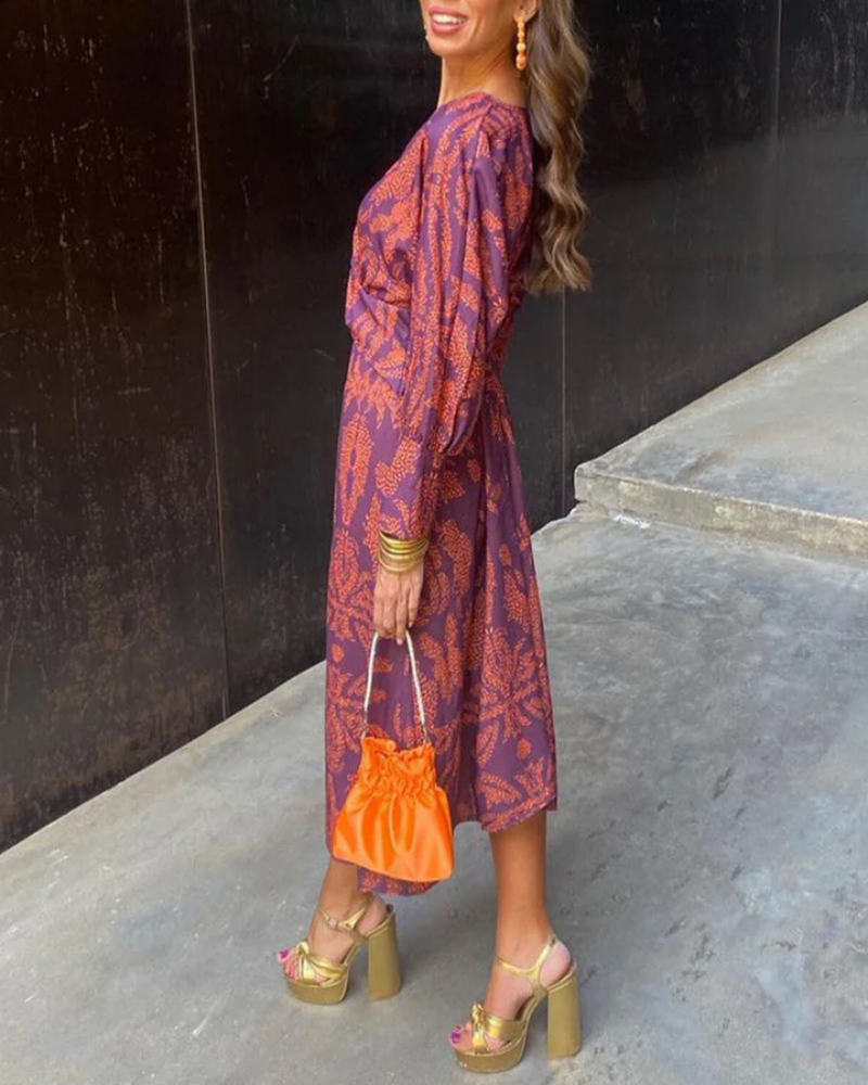 Statement printed V-neck long sleeve women's dress, a sophisticated evening gown for any event.