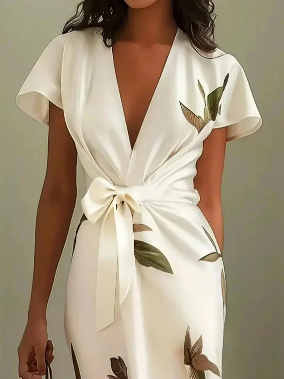 Versatile women's printed midi wrap dress for wedding guests, cocktail parties or brunch. V-neck, flutter sleeves.