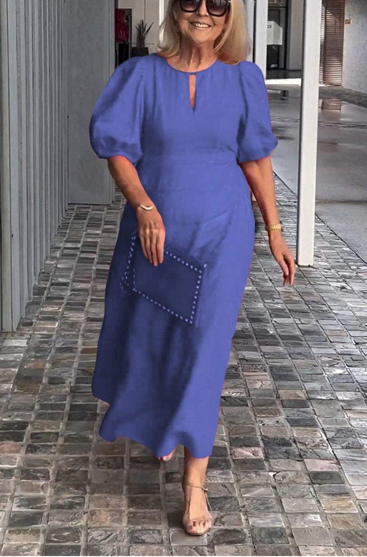 Beautiful women's formal midi dress with puff sleeves, A-line cut, and elegant wedding guest style.