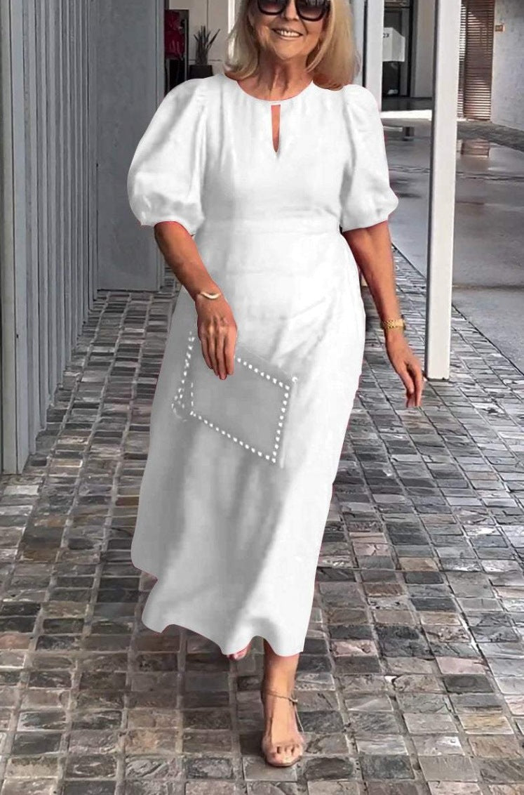 Women's elegant A-line midi dress with long puff sleeves, a stylish choice for formal events.