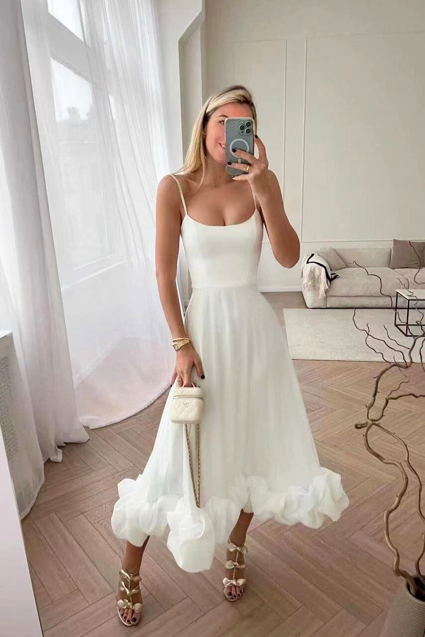 Chic women's party dress: long ruffle hem maxi with delicate spaghetti straps and elegant design.