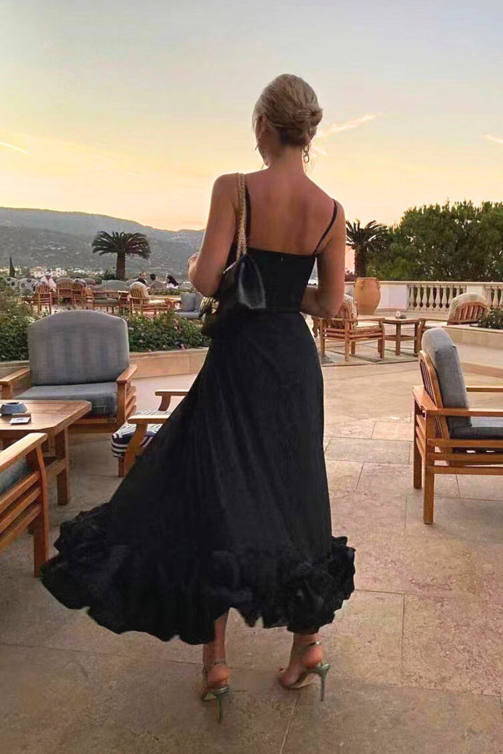 Elegant women's scoop-neck maxi dress, perfect for special occasions, features spaghetti straps and ruffle hem.