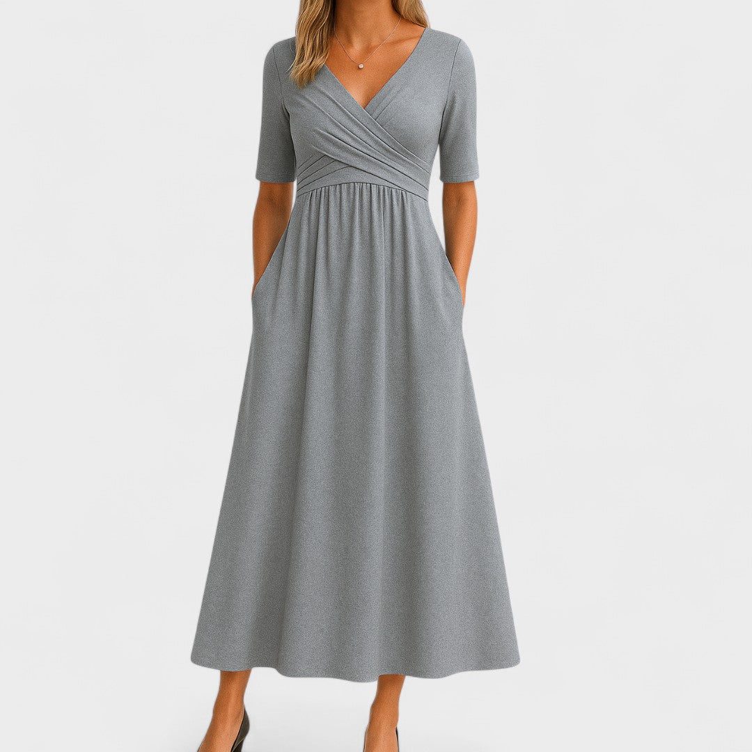 Elegant women's semi-formal A-line wrap dress with 3/4 sleeves, perfect for cocktails or workwear.