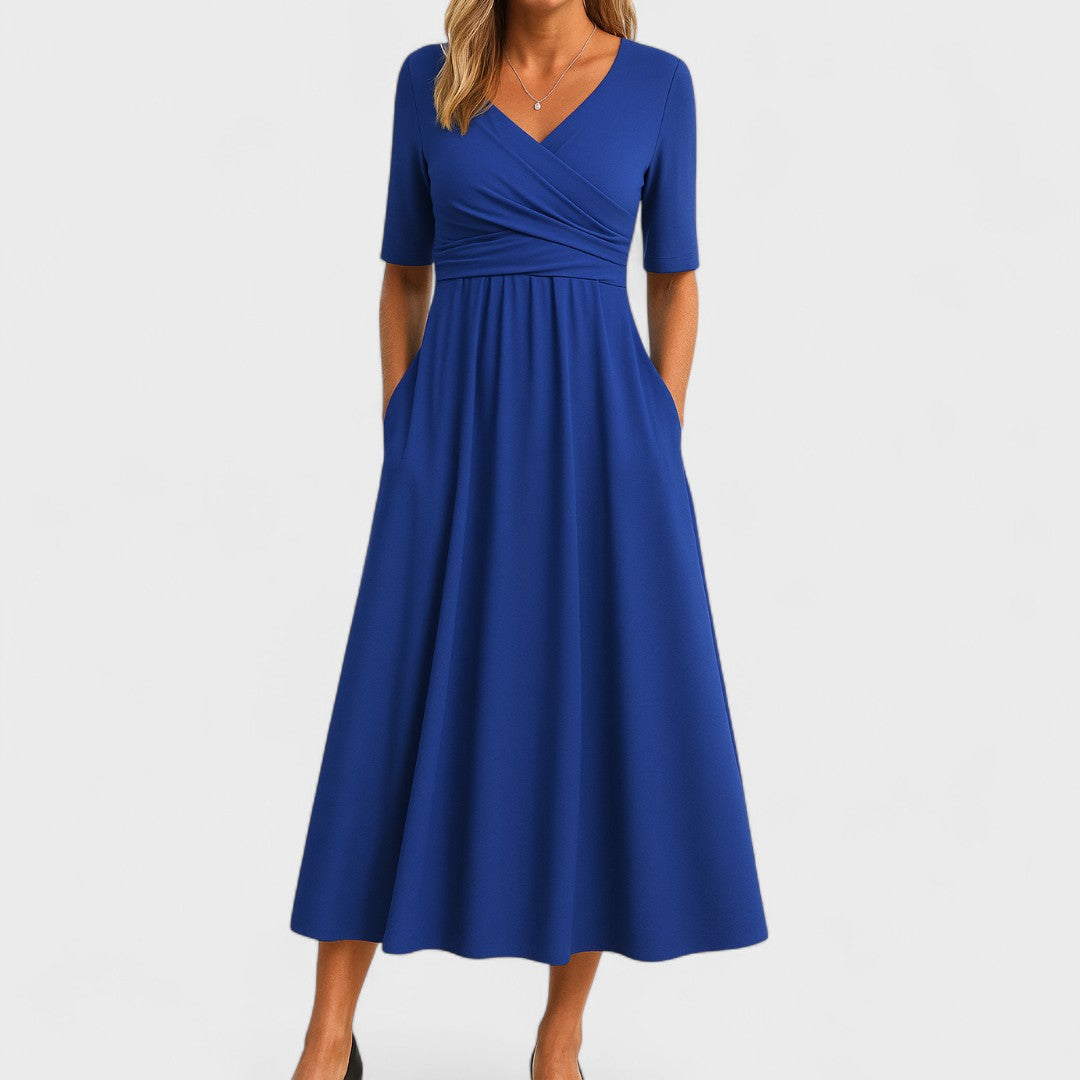 Back view of women's elegant A-line wrap midi dress, showing graceful drape and comfortable fit.