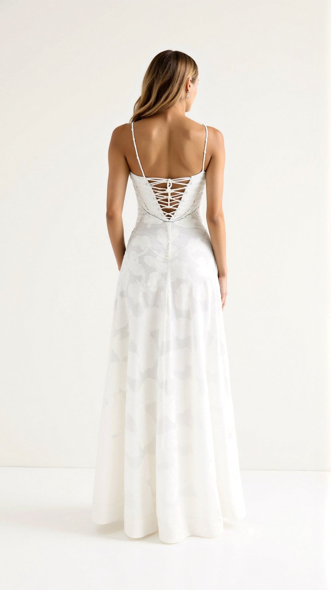 Sleeveless formal maxi dress with bustier detail, an elegant choice for a wedding guest