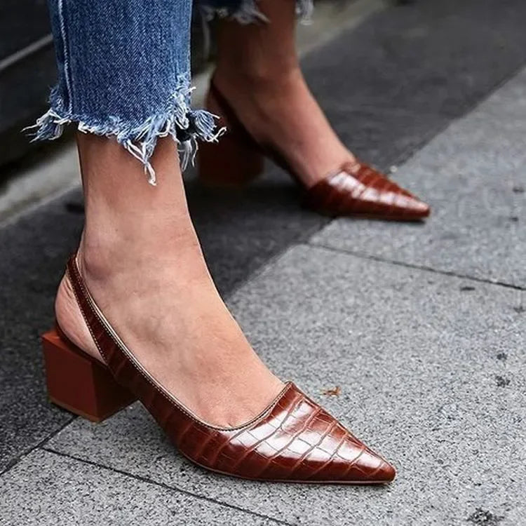 Close-up of a women's elegant block heel pump, showcasing its comfortable design and sophisticated silhouette.