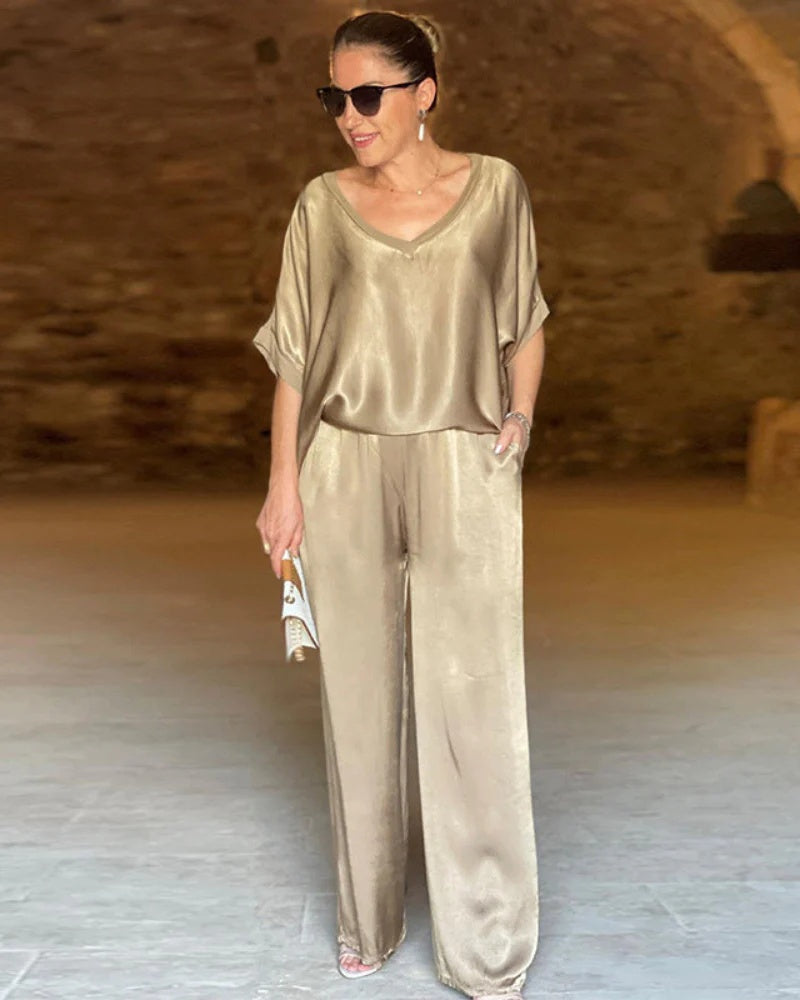 Casual chic women's two-piece set, featuring a stylish top & matching pants for a coordinated spring look.