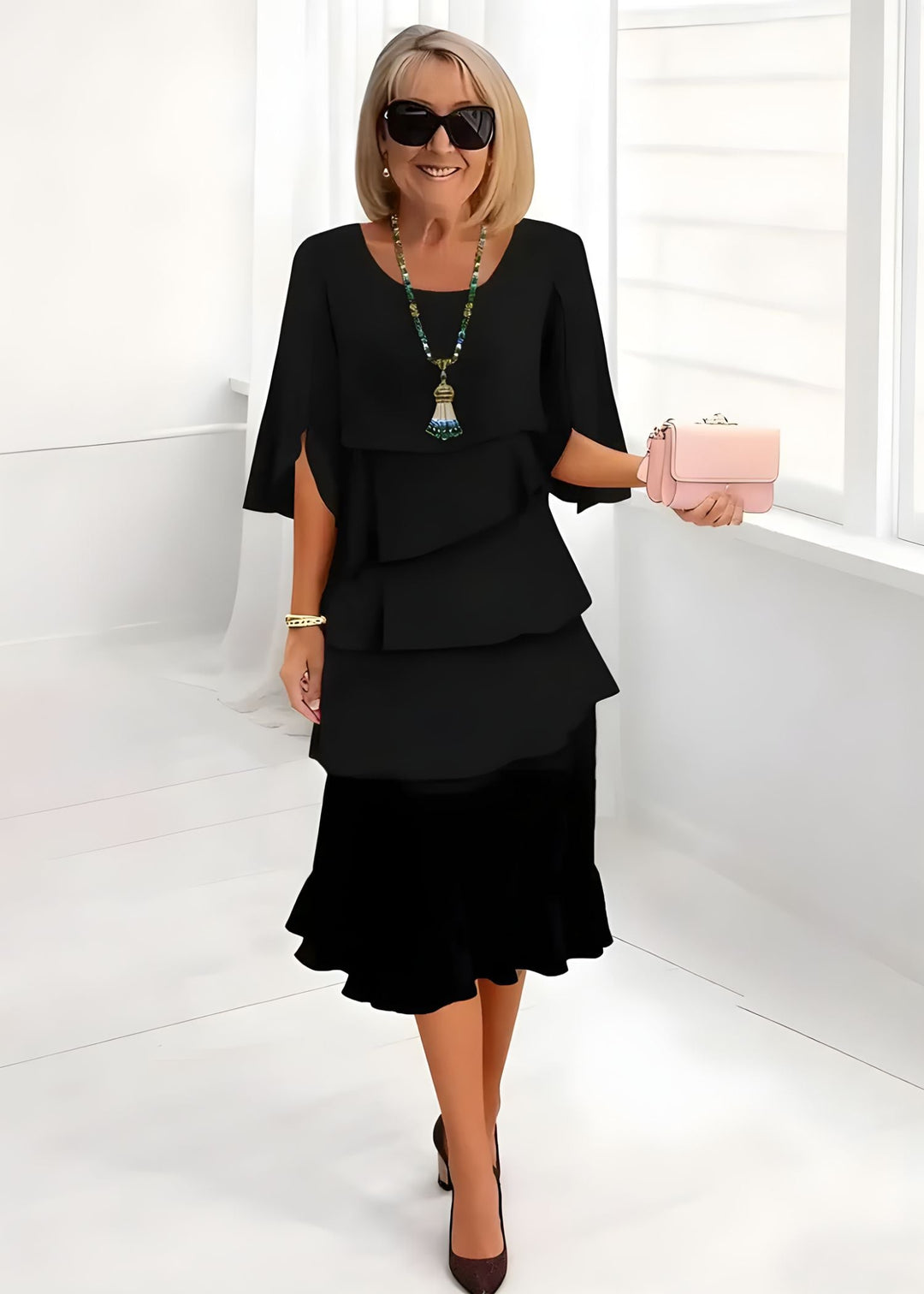 Flowing women's tiered midi dress with delicate ruffles & fashionable flared sleeves. Elegant summer style.