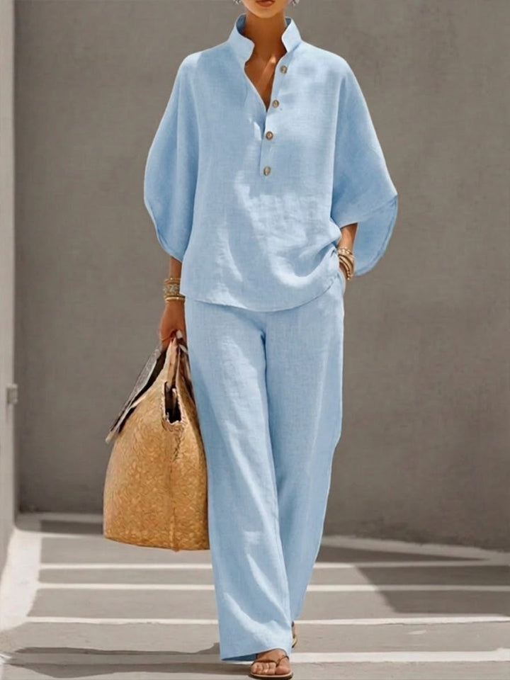 Stylish women's coordinating set featuring a chic batwing top and comfortable wide-leg fashion trousers.