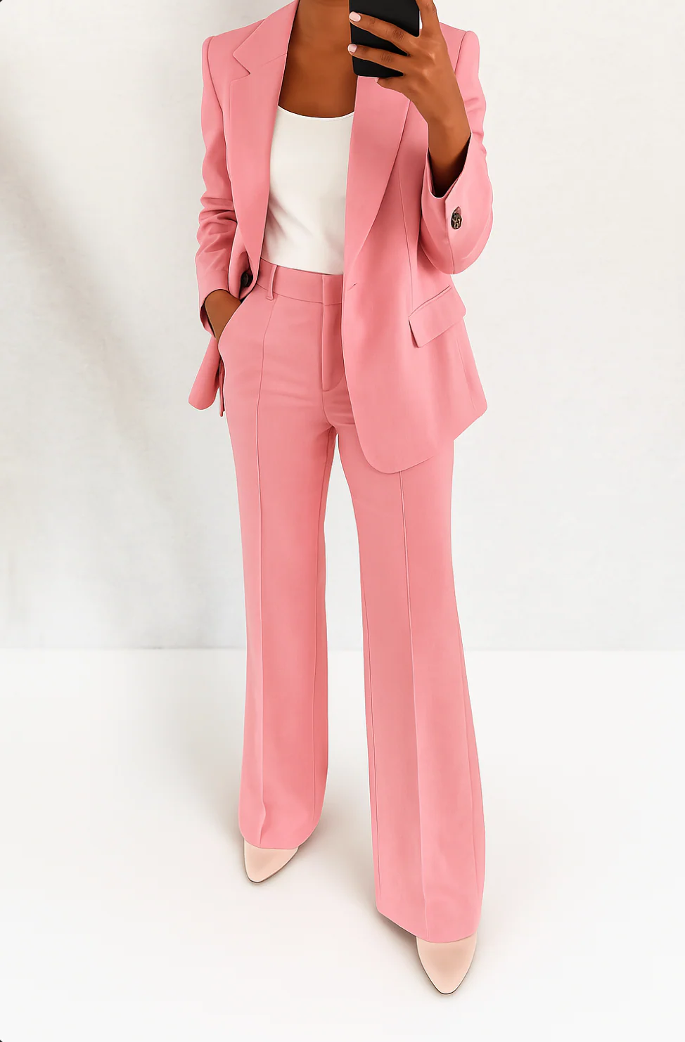 Formal women's business suit set with a sleek blazer and flattering wide-leg trousers. Ideal for office and professional wear.