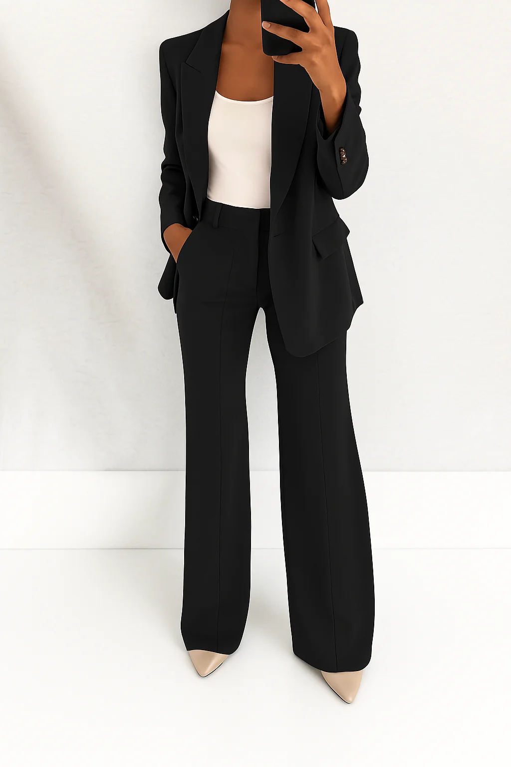 Sophisticated women's workwear blazer and matching wide-leg pants two-piece set. Elegant fashion for the professional.