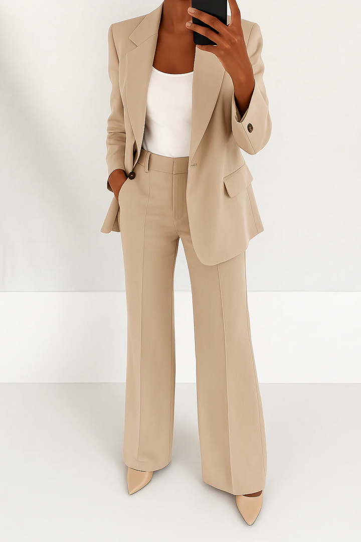 Professional women's suit with a chic blazer and elegant straight-leg trousers for workwear attire.
