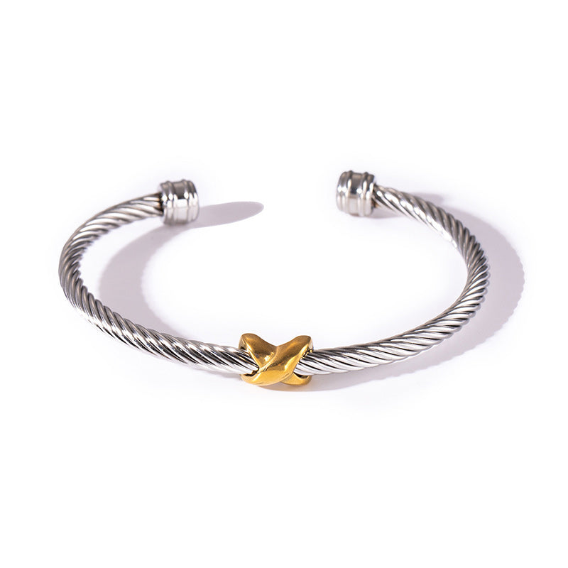 Beautifully crafted women's two-tone knot twisted bangle bracelet, an elegant jewelry piece.