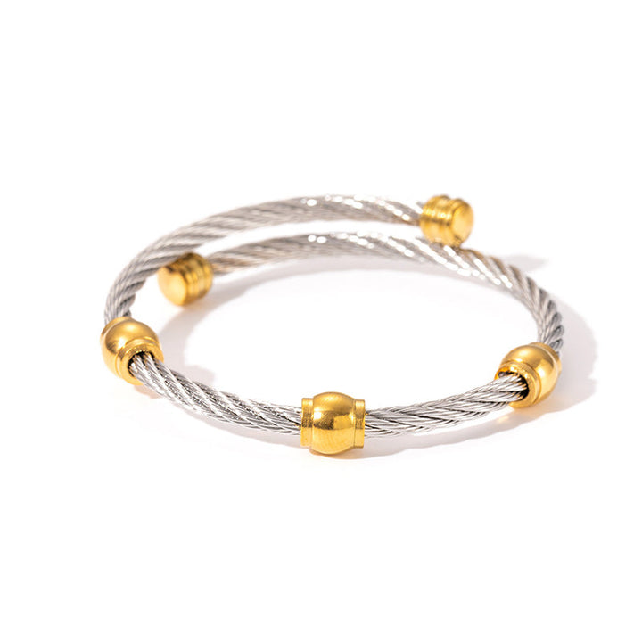 Modern two-tone knot stainless steel bangle bracelet, a stylish accessory for women.