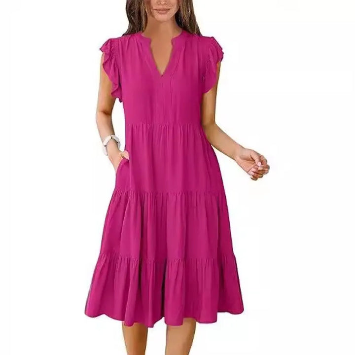 Women's V-neck tiered midi dress with flutter sleeves & convenient side pockets. Chic & comfortable summer style.