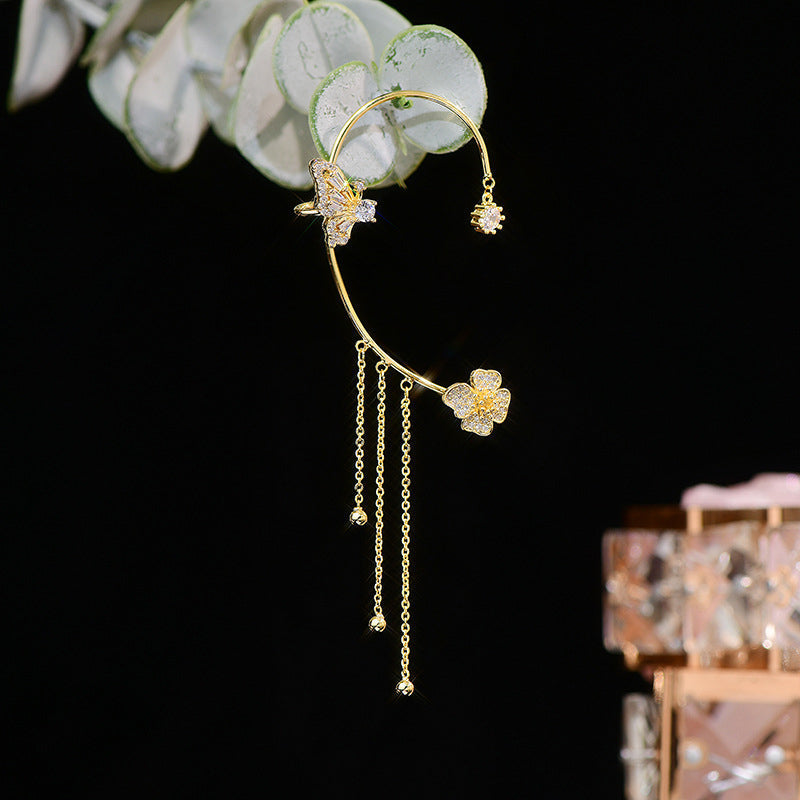 Women's elegant dangle earrings, showcasing intricate butterfly design and brilliant zircon accents.