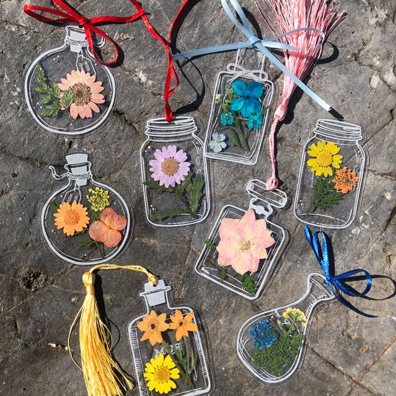 Assortment of handmade transparent bookmarks, each with a distinct floral pattern