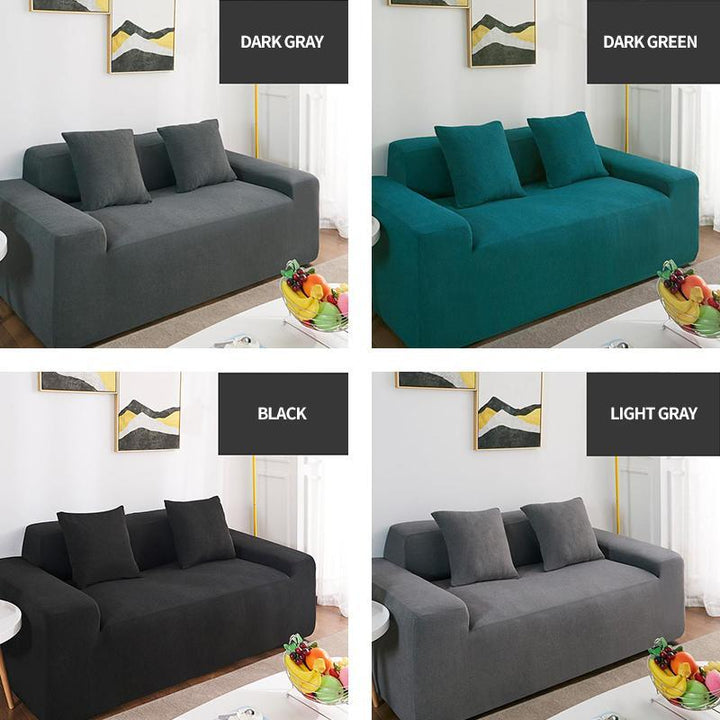 Living room with a sleek black elastic sofa cover, providing a sophisticated and pet-friendly furniture solution.