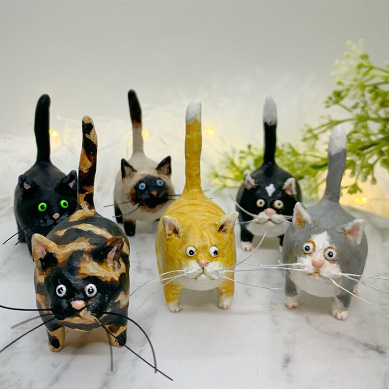 Artisan miniature cat figurine, featuring vibrant hand-painted accents for home decor.