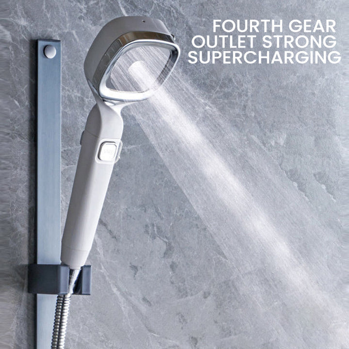 Detail view of the pause switch on a universal handheld pressurized shower head, ensuring water efficiency.