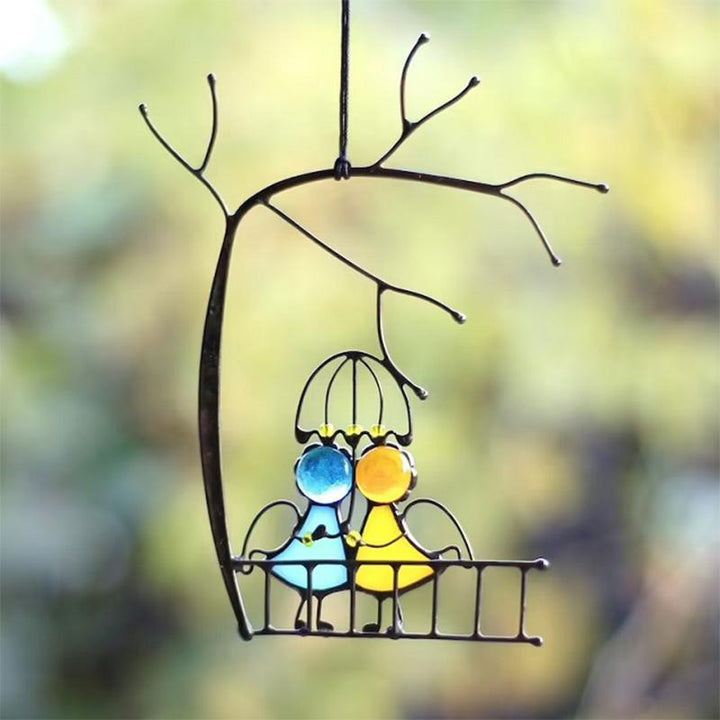 Decorative stained glass angel suncatcher, handcrafted with epoxy, capturing light beautifully as window art.