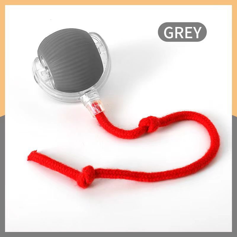 Close-up of a cat paw gently tapping the Interactive Cat Play Ball, fun kitten toy