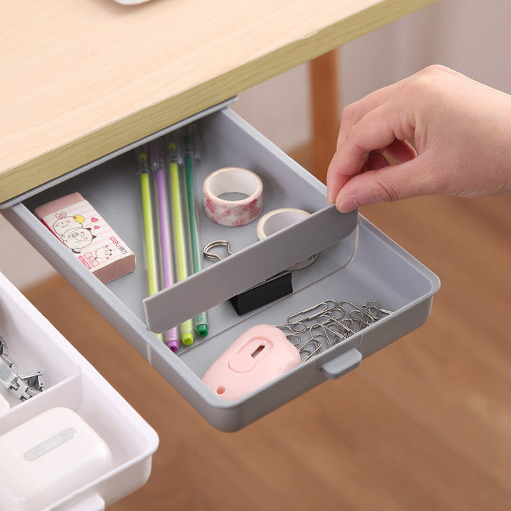 Seamless under desk storage drawer in light wood finish, blending with office decor.