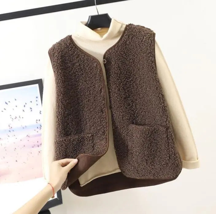 Khaki women's relaxed fit sleeveless outerwear vest, perfect for casual layering and comfort.