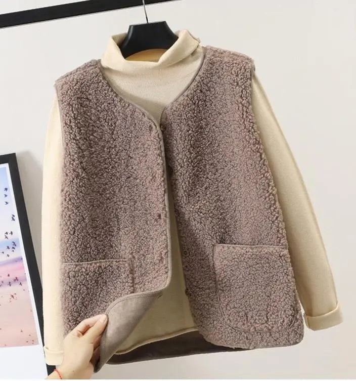 Relaxed fit women's outerwear vest in a versatile beige, sleeveless design for effortless style.
