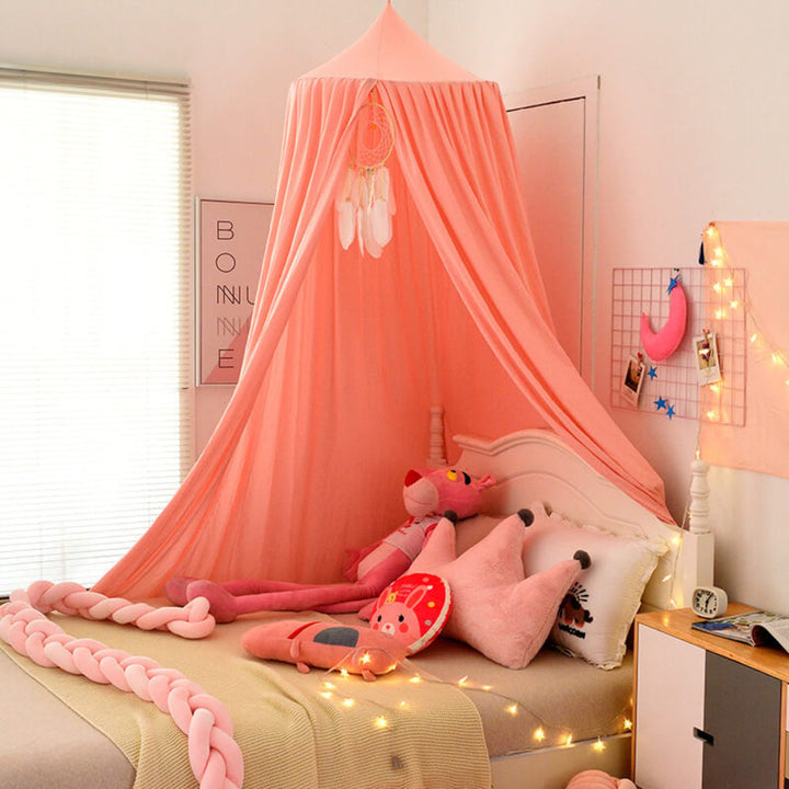 Nursery decor: a charming hanging bed net canopy, creating a whimsical and cozy sleep area.