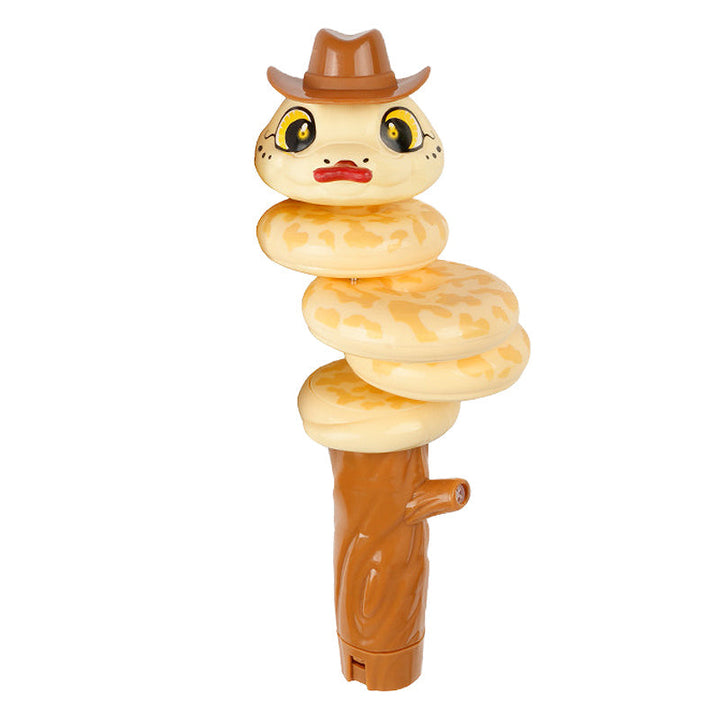Close-up view of the playful head of a swinging snake whistle toy, featuring cartoonish eyes