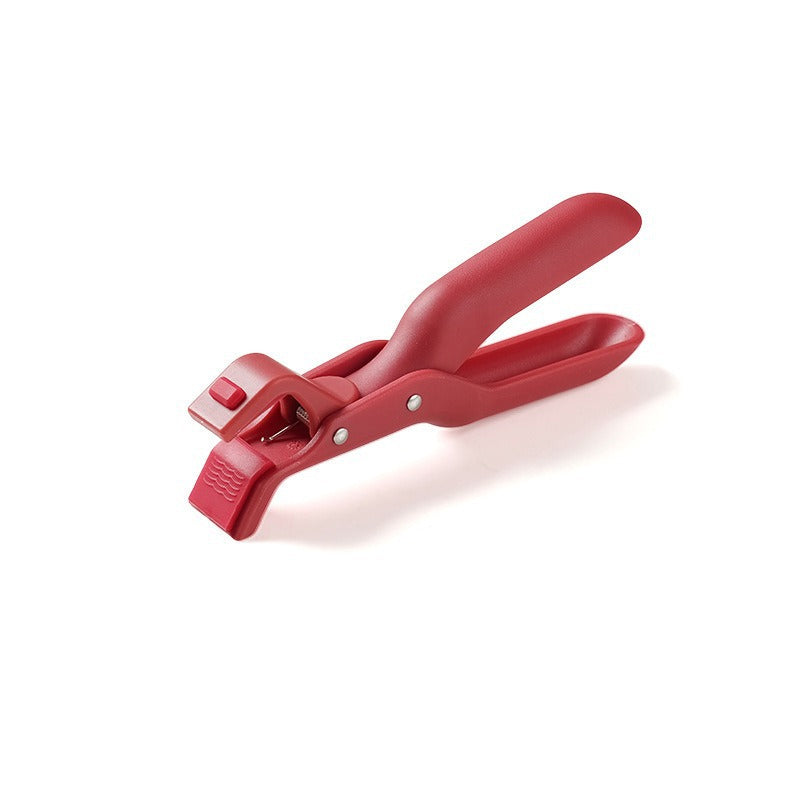 Anti-scald bowl clip resting on a kitchen counter, ready for use with hot pots and pans.