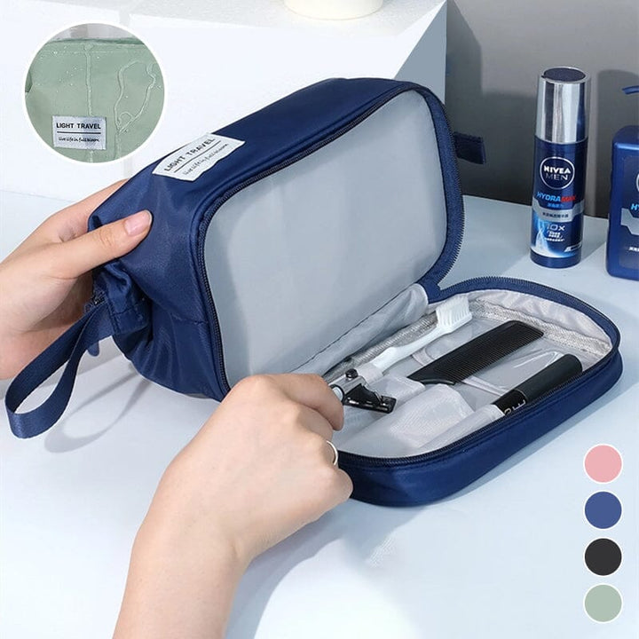 Large capacity waterproof toiletry bag in black, open to show multiple compartments, ideal for travel organization.