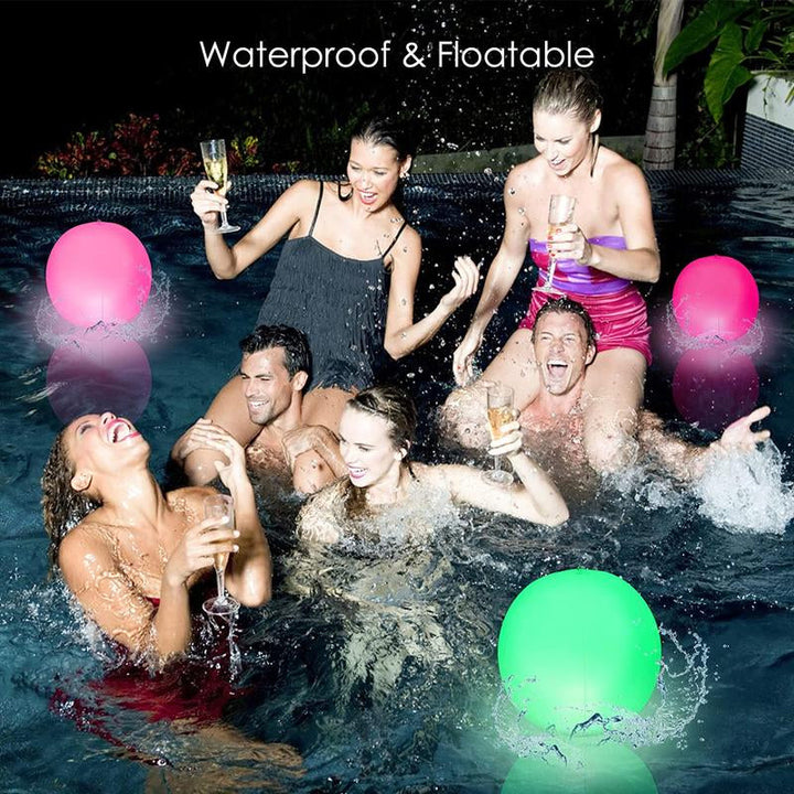 Brightly lit LED inflatable beach ball on grass, ideal for backyard games